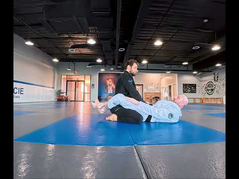 Closed Guard position for Jiu Jitsu (side view)